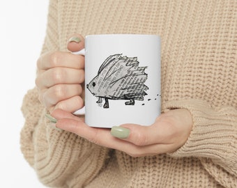 Small but fierce ... customized ceramic coffee mug with cute hedgehog created with a hebrew newspaper and a Star of David necklace