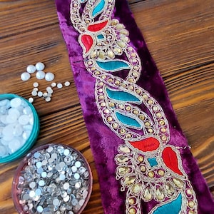 Lilac braid on velvet with colored embroidery and rhinestones, traditional decoration of Afghan clothing, baludji, Indian lace.