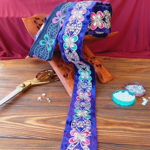 Velvet braid with colored embroidery and purple rhinestones, traditional decoration of Afghan clothes, baludji, Indian lace.