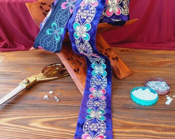 Velvet braid with colored embroidery and purple rhinestones, traditional decoration of Afghan clothes, baludji, Indian lace.