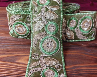 Delicate green lace embroidered with green and gold threads, beautiful and festive lace in oriental style for decoration, wedding lace.