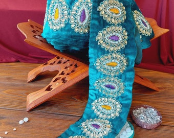 Turquoise braid on velvet with colored embroidery and rhinestones, traditional decoration of Afghan clothing, baludji, Indian lace.