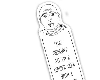 May include: A black and white illustration of a man with a quote from Karl Pilkington: "YOU SHOULDN'T SIT ON A LEATHER SOFA WITH A BARE ARSE".