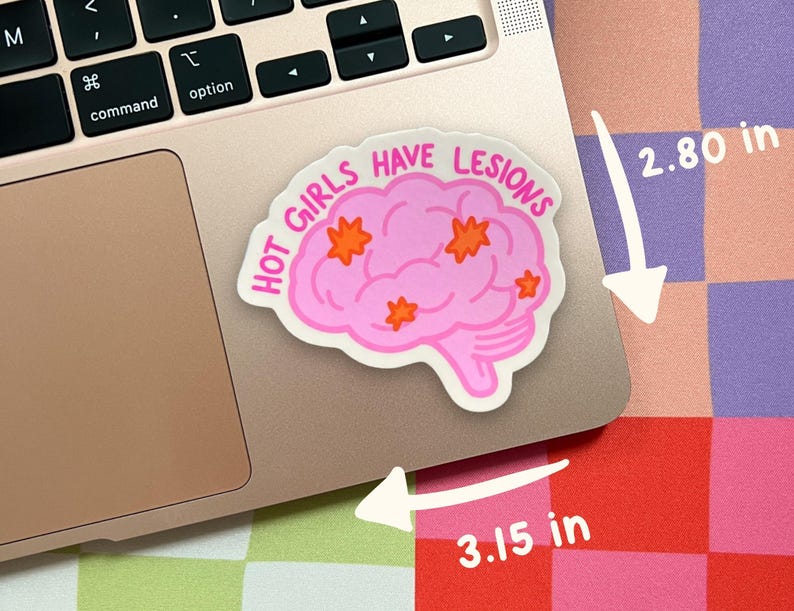 May include: A die-cut sticker featuring a pink brain illustration with orange star-shaped accents and the text "HOT GIRLS HAVE LESIONS" in pink lettering. The sticker measures 2.80 inches by 3.15 inches as indicated by the white arrows.