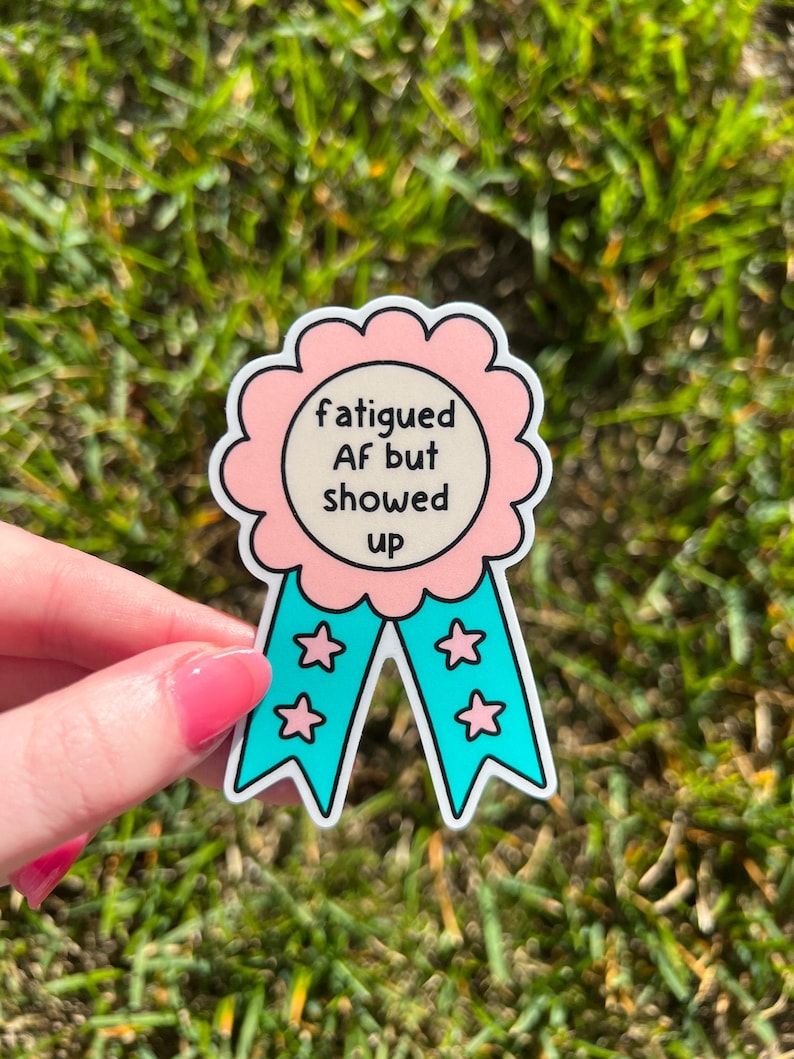 Fatigued AF Vinyl Sticker: Pink and Blue Award Ribbon that says, "Fatigued AF but Showed Up" in the center.