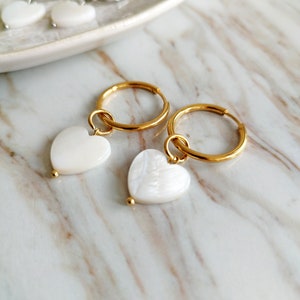Small hoop earrings with charm from Mother of Pearl heart earrings
