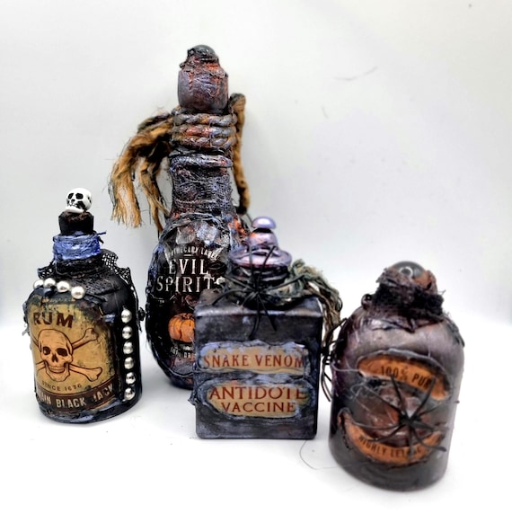 A set of four hand-sculpted gothic apothecary potion bottles that look like they were raided from a Victorian alchemist's shelf — not your average Halloween dollar-store fare.