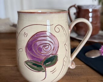 Pottery cup with rose decoration