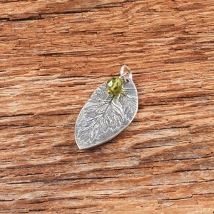 Wild leaf pendant with olive green peridot, fine silver gift for nature lover, Irina Miech