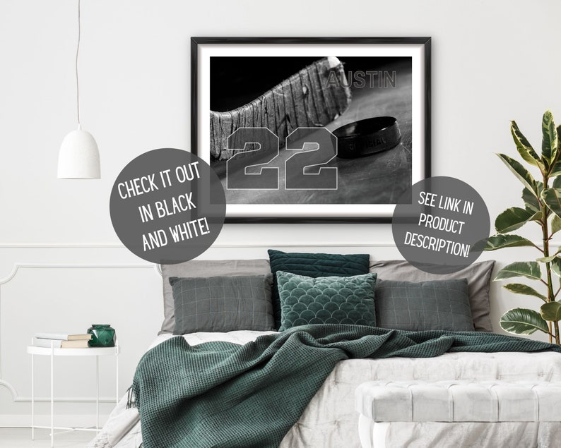 May include: Black and white photo of a hockey stick and puck with the number 22 and the word "AUSTIN" printed on the image.