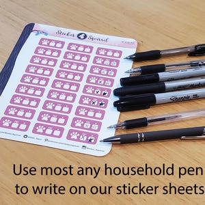 May include: A sheet of pink and white stickers with paw prints and the text "Sticker Squirrel". The sheet is designed for use with a variety of pens, as shown in the image.