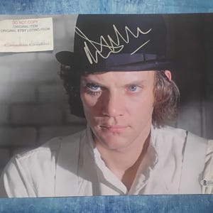 May include: A rustic wooden sign with the text "Welcome to our home" in a handwritten style. The sign is rectangular, with a distressed finish, and features a simple, inviting design. It's suitable for indoor or outdoor use.