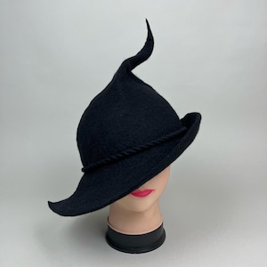 Charming witch hat / hand felted black witchy hat with a flower