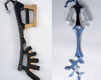 May include: Two decorative keyblade props. One is black and gold with a chain and charm. The other is silver and blue with a chain. Both are designed with intricate details and are likely for cosplay or display.