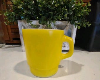 Anchor Hocking Fire King yellow stackable mug. Crafted from durable milk glass