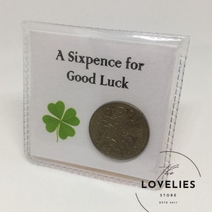 Lucky Sixpence Keepsake in protective plastic wallet. The front reads, A Sixpence for Good Luck.