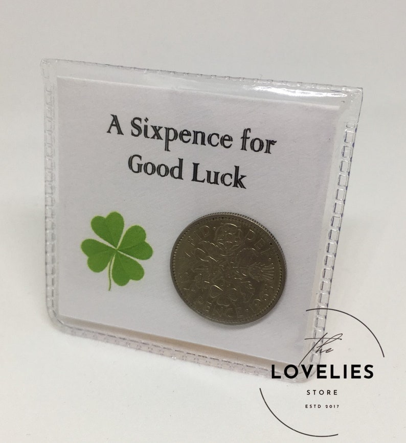 Lucky Sixpence Keepsake in protective plastic wallet. The front reads, A Sixpence for Good Luck.