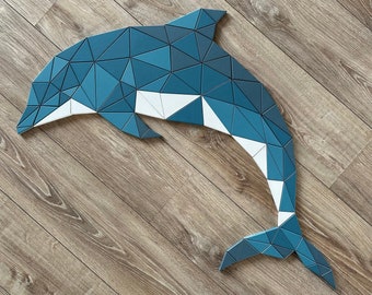 Polygonal wooden dolphin shape wall decoration. Geometric puzzle.
