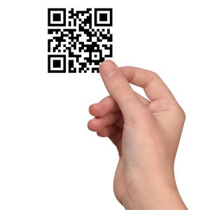 May include: A hand holding a black and white QR code.