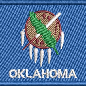 May include: Embroidered patch featuring the Oklahoma state seal. The design includes a central shield with a green feather, a white peace pipe, and a brown circle. The word "OKLAHOMA" is embroidered in white at the bottom, set against a blue background.
