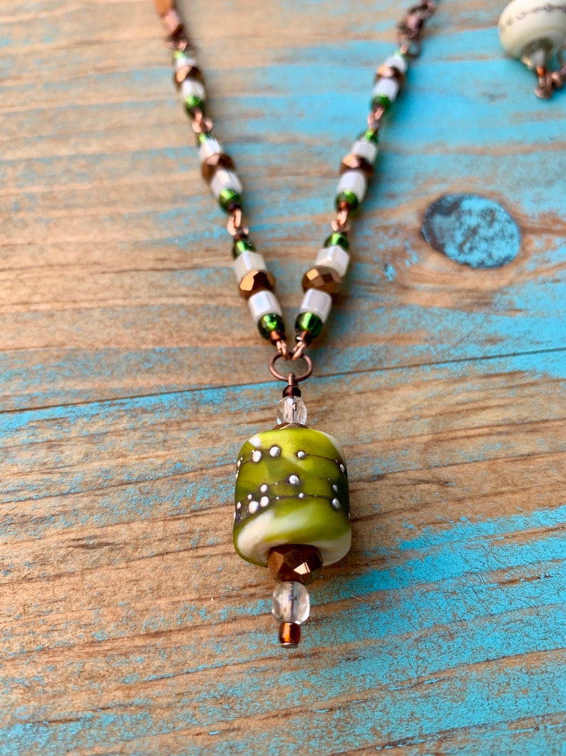 Green and ivory lampwork set