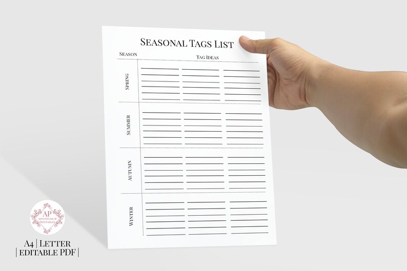 May include: A printable A4 sheet with a list of seasonal tags. The sheet is divided into four sections: Spring, Summer, Autumn, and Winter. Each section has a column for "Season" and a column for "Tag Ideas".