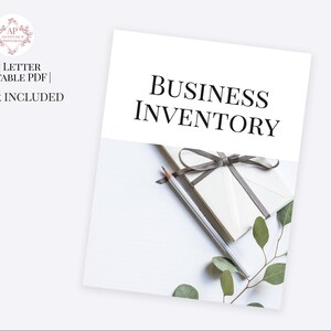 May include: A white sheet of paper with the text "BUSINESS INVENTORY" printed in black. A white envelope with a gray ribbon tied around it is on top of the paper. A pencil is lying on the paper next to the envelope. A sprig of green leaves is on the right side of the image.