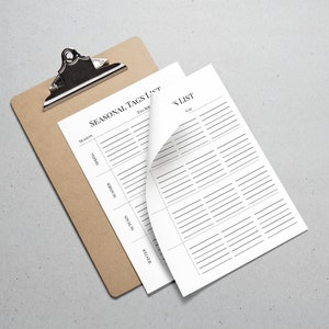 May include: A brown clipboard with a white sheet of paper that has the title "Seasonal Tags List" and a column for each season: Spring, Summer, Autumn, Winter. The paper is partially folded over to reveal a second sheet of paper with the title "Tag List" and a column for "Tags".