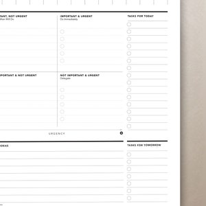 Peut inclure: Un agenda noir et blanc avec un agenda quotidien, des t&acirc;ches pour aujourd'hui et demain, et une section pour les t&acirc;ches importantes et urgentes. L'agenda comprend &eacute;galement une section pour les id&eacute;es et une &eacute;chelle d'urgence.
