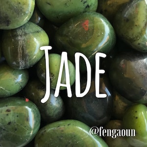 May include: A close-up of a collection of smooth, green jade stones. The word "JADE" is written in white letters across the center of the image. The text "@fengaooun" is written in white letters in the lower right corner of the image.