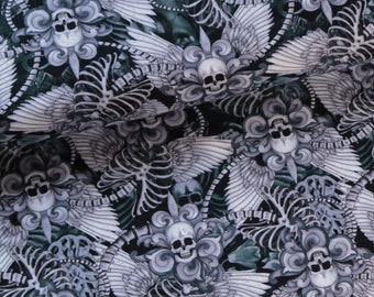 May include: Black fabric with a repeating pattern of white skeletal wings, skulls, and floral designs.