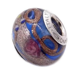 May include: Blue glass bead with gold and silver accents and a silver charm with the word "ITALY" on it.
