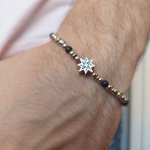 Steel men&#39;s bracelet with wind rose. Chain bracelet with balls
