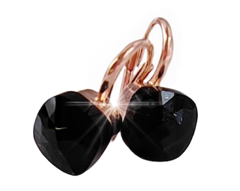 May include: Rose gold earrings with black square-shaped gemstones.