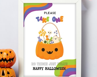 May include: A framed Halloween print featuring an orange pumpkin basket filled with sweets. The text reads "PLEASE TAKE ONE" and "NO TRICKS JUST TREATS HAPPY HALLOWEEN". The print is in a white frame and has colourful decorative elements.