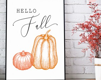 May include: A white printable sign with black text that says "HELLO fall" and a drawing of two orange pumpkins.