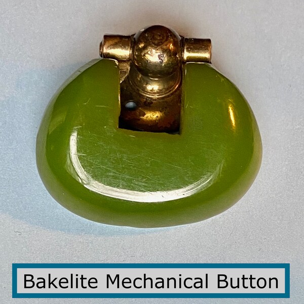 Wonderful Mid-20th Century Mechanical Bakelite & Brass Button NBS Large Green Bakelite