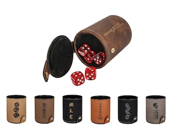 May include: A set of eight brown leather dice cups with different designs and text. The cups are open and show red dice inside. The text on the cups includes "Roll With It", "M.L.T", "CROWN", "BINGO", and "LIONS SHARE FINANCIAL GROUP".