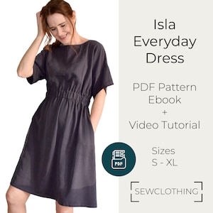 以下が含まれることがあります： 濃いグレーのIsla Everyday Dressを着た女性。ドレスは半袖で、ウエストにギャザーが入っています。画像には「Isla Everyday Dress」、「PDF Pattern Ebook + Video Tutorial」、「Sizes S-XL」というテキストが含まれています。