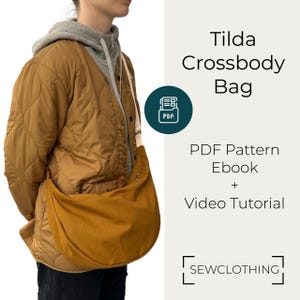 May include: Mustard-colored Tilda Crossbody Bag, worn over a quilted brown jacket. The bag is a crescent shape with a long strap. Text on the right reads "Tilda Crossbody Bag" and "PDF Pattern Ebook + Video Tutorial". The logo for Sewclothing is at the bottom.