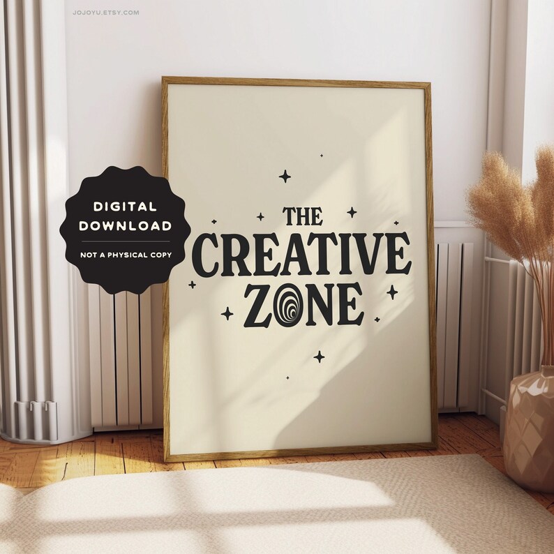 May include: A digital download print with a beige background and black text that reads "The Creative Zone" with a stylized swirl design. The text is surrounded by small stars.