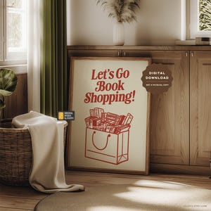 May include: A printable digital download poster with a red and white design. The poster features a shopping bag filled with books and the text "Let's Go Book Shopping!" in a red retro font.