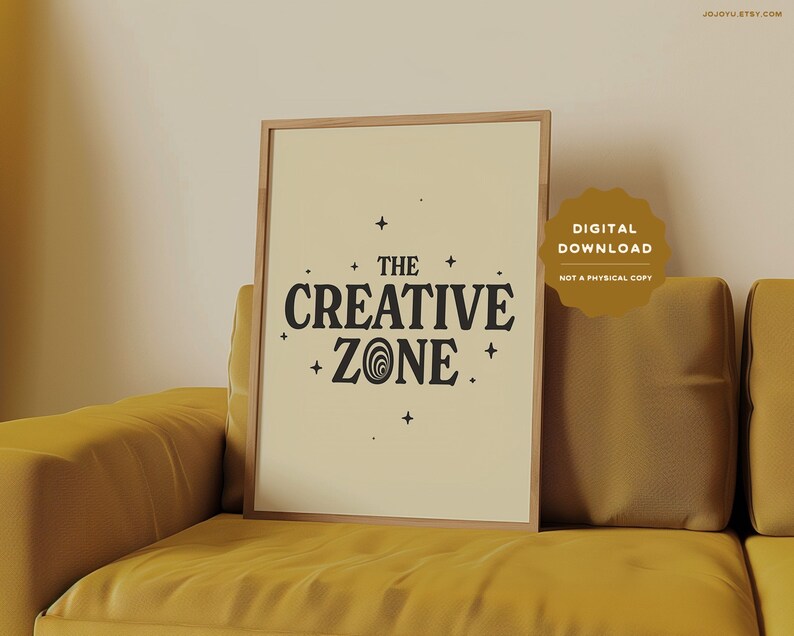 May include: A digital download print with a beige background and a black graphic that says "THE CREATIVE ZONE" with stars and a swirl design.