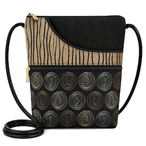May include: A black crossbody bag featuring a top section with a gold and black vertical wavy line pattern. The lower section displays a repeating pattern of gold, bronze, and silver spiral circles on a black background, with gold zippers.