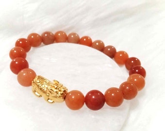 Apricot Fuzz Carnelian Bracelet: Gold Piyao Charm, Feng Shui Jewelry