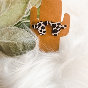 Cow print stud earrings