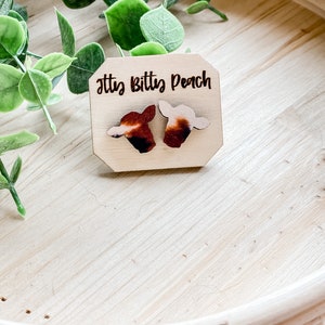 Cow print stud earrings