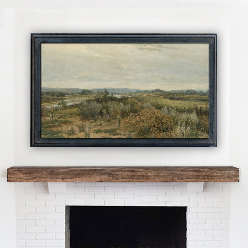 May include: A framed landscape painting depicting a river winding through a field of green and brown brush. The sky is a light gray with a few clouds.
