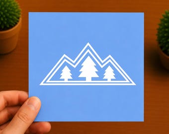 May include: A square light blue card featuring a white graphic of three stylized pine trees set against a mountain range outline. The design consists of clean, geometric lines forming a triangular peak shape with a smaller tree on each side.