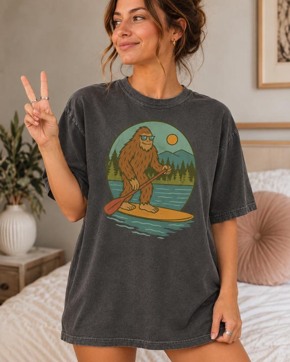 Funny Bigfoot Paddleboarding Comfort Colors T-Shirt, Sasquatch SUP Graphic Adult Tee